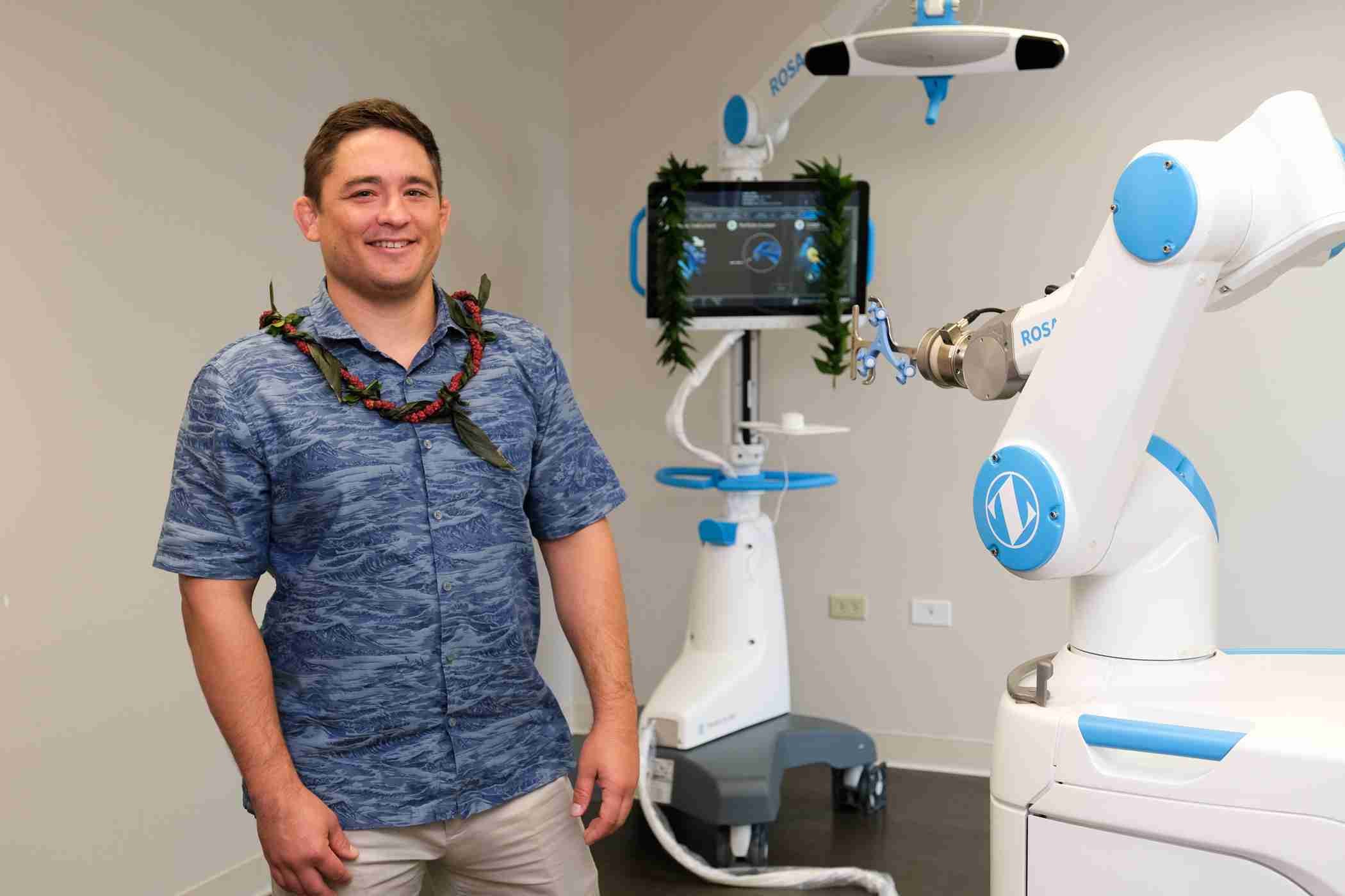Dr. Paul Norio Morton with the ROSA robotic-assisted surgical system in Hawaii
